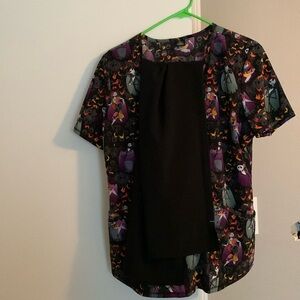 Nightmare Be Christmas scrub top with black scrub bottoms